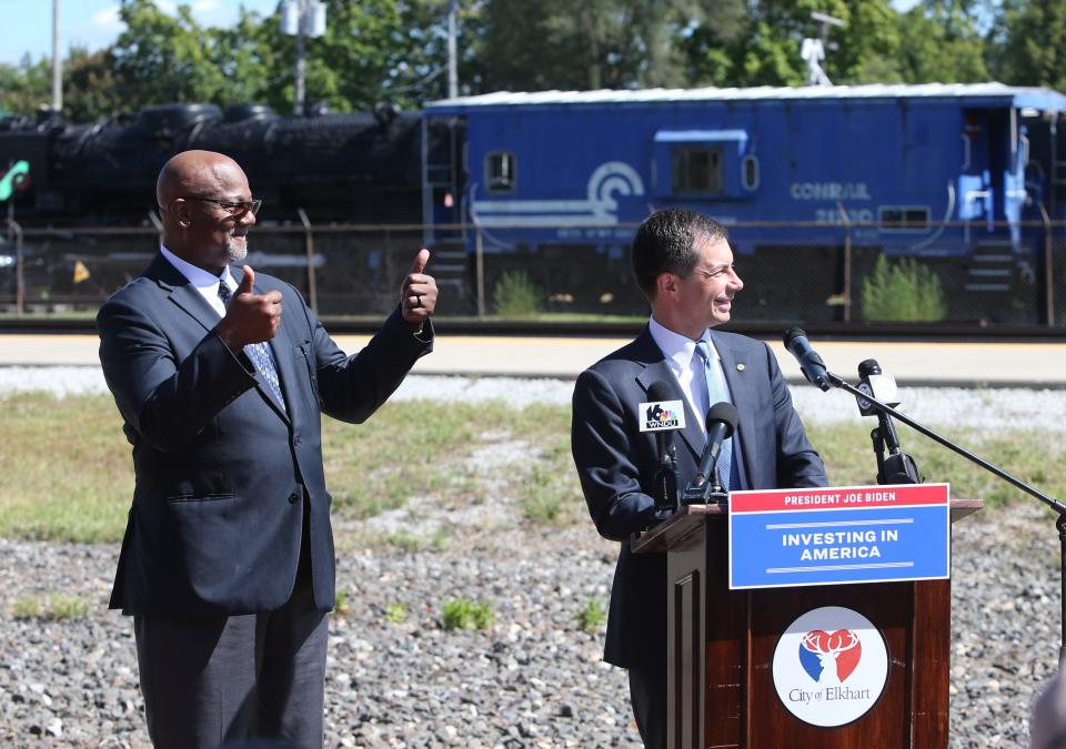 Elkhart Mayor Rob Roberson gestures at a loud passing train as U.S. Secretary of Transportation and former South Bend mayor Pete Buttigieg speaks at the Elkhart Train Depot Wednesday, Aug. 30, 2023, during a visit to talk about federal funding for rail improvements in the city.