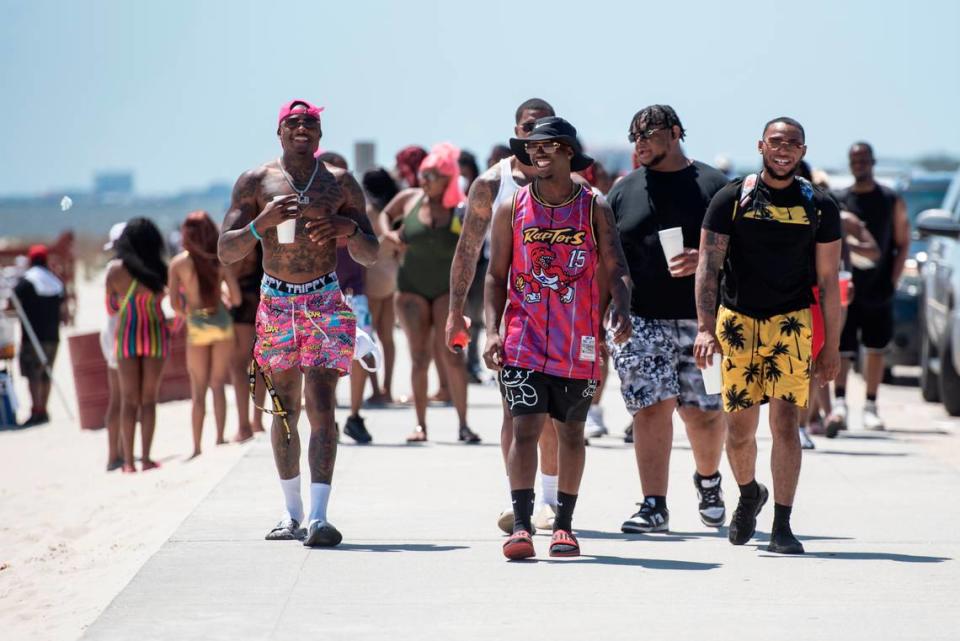 Spring breakers enjoy the weather at Biloxi Beach during Black Spring Break in Biloxi on Saturday, April 13.