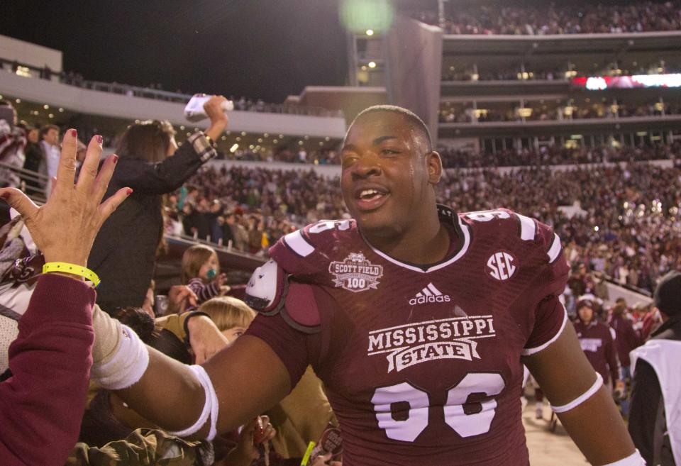 Nov 1, 2014; Starkville, MS, USA; Mississippi State Bulldogs defensive lineman Chris Jones (96) celebrates with the fans during the game against the Arkansas Razorbacks at Davis Wade Stadium.  The Bulldogs defeat the Razorbacks 17-10. Mandatory Credit: Marvin Gentry-USA TODAY Sports