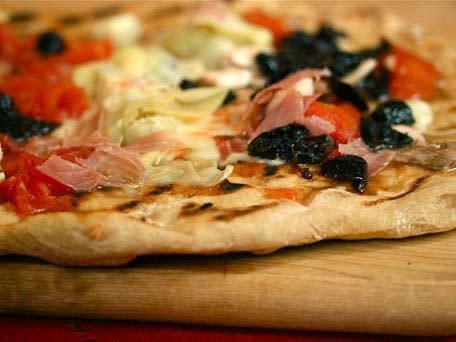 <strong>Get the <a href="http://www.huffingtonpost.com/2011/10/27/pizza-quattro-stagioni_n_1059230.html">Pizza Quattro Stagioni</a> recipe</strong>