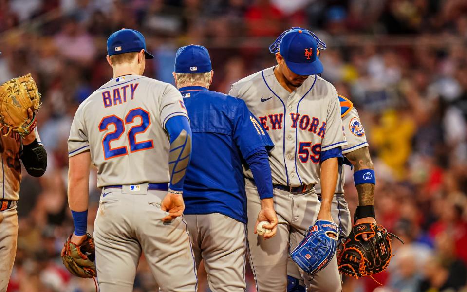 New York Mets manager Buck Showalter (11) relieves starting pitcher Carlos Carrasco (59) in the third inning against the Boston Red Sox on July 23, 2023, at Fenway Park.  Mandatory Credit: David Butler II-USA TODAY Sports