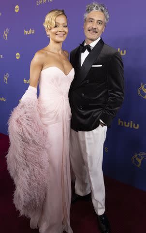 <p>Disney/Laura Grier</p> Rita Ora and Taika Waititi at the 2024 Emmys