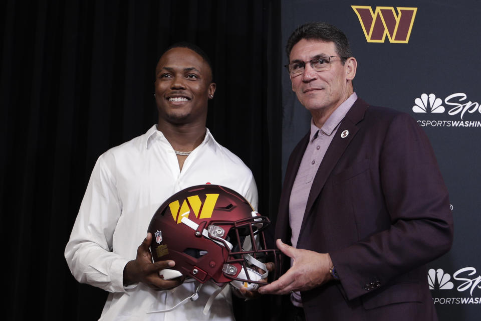 Washington Commanders NFL football team new wide receiver Terry McLaurin, left, poses with head coach Ron Rivera after a press conference at Inova Sports Performance Center in Ashburn, Va., Wednesday, July 6, 2022. (AP Photo/Luis M. Alvarez)