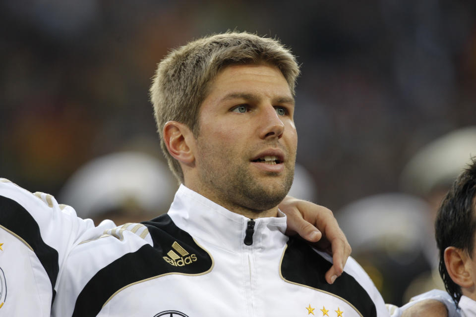 In this picture taken Oct. 14, 2009 Germany's Thomas Hitzlsperger waits during the national anthem prior the World Cup Group 4 qualifying soccer match between Germany and Finland in Hamburg, northern Germany. Former Germany midfielder Thomas Hitzlsperger announced he is gay on Wednesday Jan. 8, 2014 , becoming likely the most prominent footballer yet to break a long-standing taboo within the sport. Hitzlsperger says in an interview given to Die Zeit newspaper, “I am expressing my sexuality because I want to promote the discussion of homosexuality among professional athletes.” The 31-year-old says he felt now was the right time, four months after retirement following a career in England, Italy and Germany, to approach a subject he feels is “simply ignored.” (AP Photo/Joerg Sarbach)