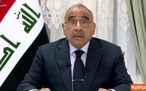 Iraqi Prime Minister Adel Abdel Mahdi gives his first televised speech following the outbreak of deadly protests in Baghdad  - Credit: AFP