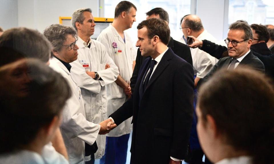 French President Emmanuel Macron visits the Pitié-Salpêtrière hospital in Paris.