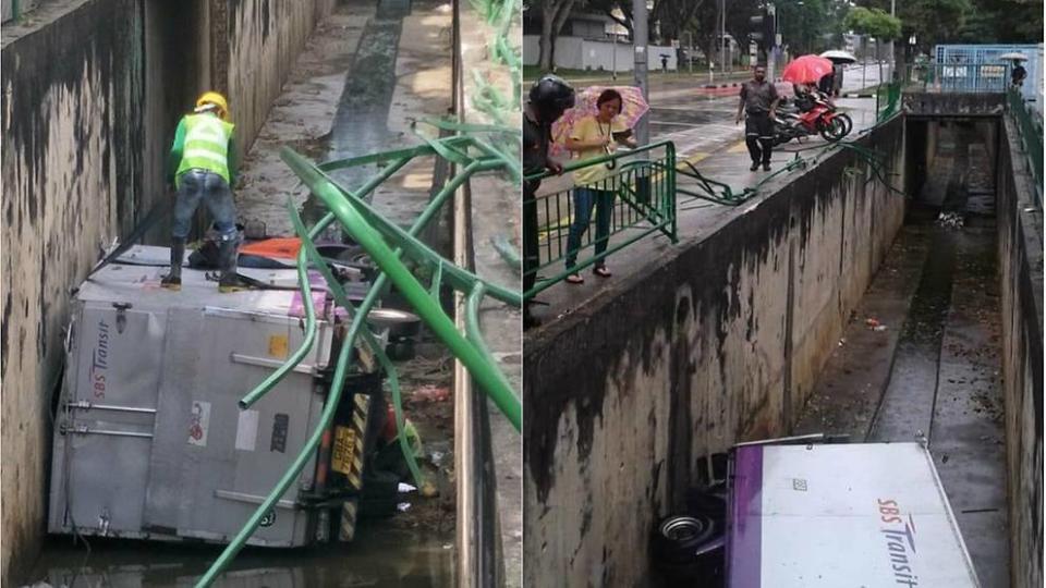 The lorry lying on its side in the drain. (Photo: Facebook / SG Road Vigilante)