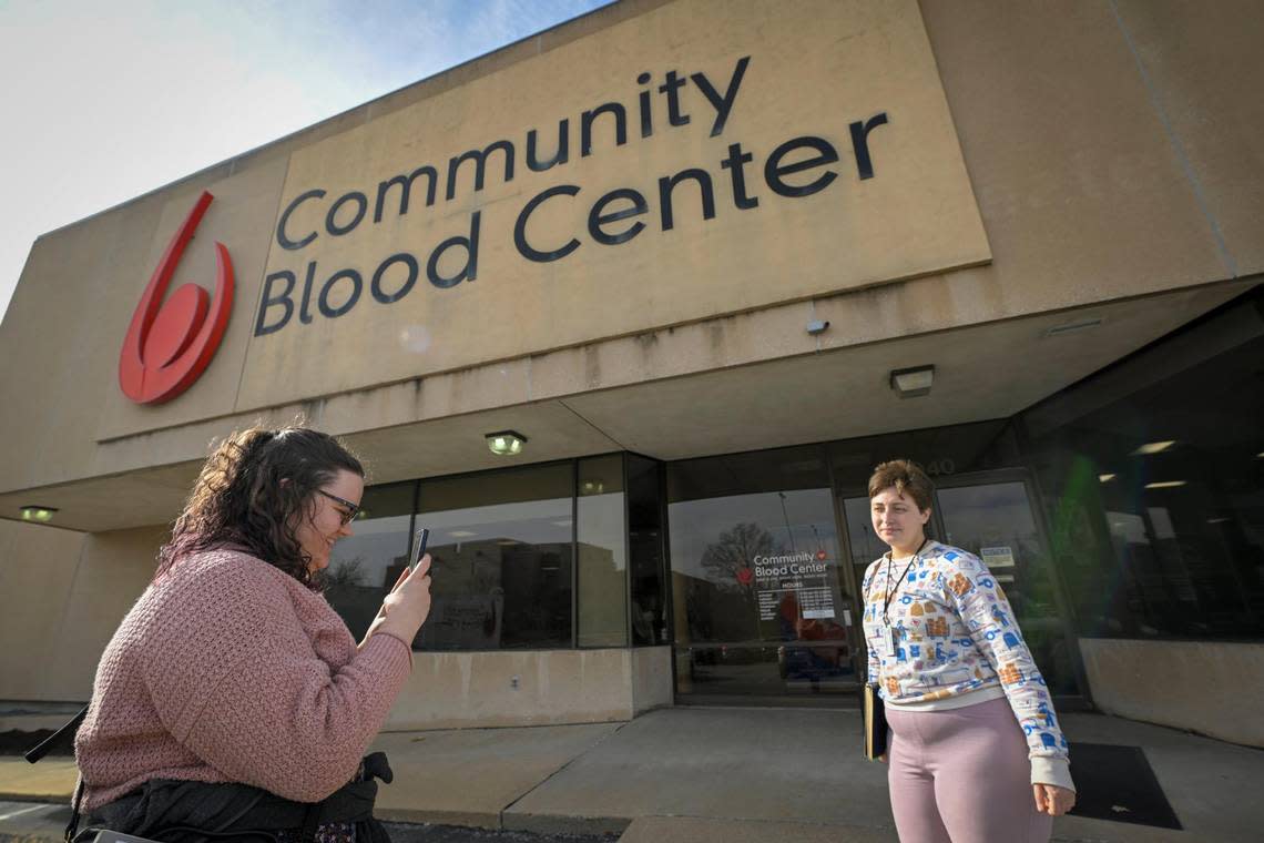 Chandler Boese, left, senior audience producer and Natalie Wallington, a service desk reporter for the Kansas City Star, arrive at the Community Blood Center on Tuesday for Wallington to donate blood for the first time.