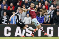 Newcastle United's Harvey Barnes scores during the English Premier League soccer match between Newcastle United and West Ham at St. James' Park, Newcastle upon Tyne, England, Saturday March 30, 2024. (Richard Sellers/PA via AP)
