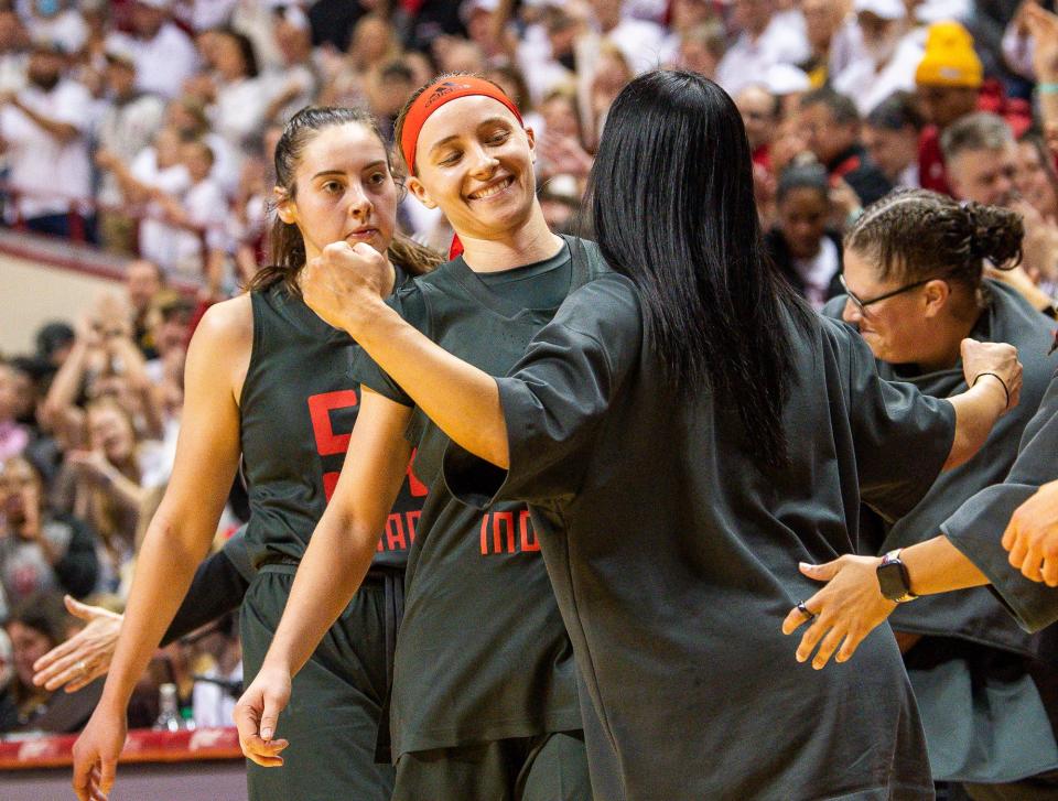 Indiana's Sara Scalia (14) celebrates as she checks out of the game during the second half of the Indiana versus Iowa women's basketball game at Simon Skjodt Assembly Hall on Thursday, Feb. 22, 2024.