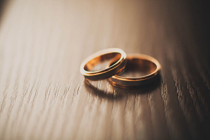 A couple's wedding rings on a table