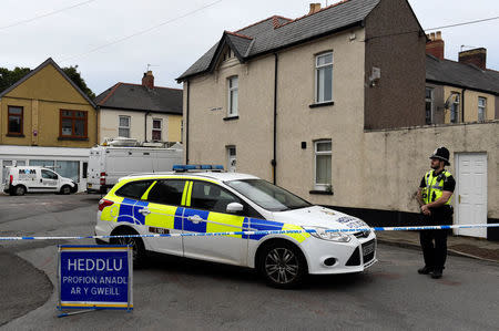 A police officer stands behind cordon tape after a man was arrested in connection with an explosion on the London Underground, in Newport, Wales, Britain, September 20, 2017. REUTERS/Rebecca Naden