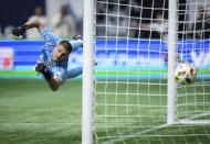 LA Galaxy goalkeeper John McCarthy allows a goal to Vancouver Whitecaps' Brian White during the second half of an MLS soccer match Saturday, April 13, 2024, in Vancouver, British Columbia. (Darryl Dyck/The Canadian Press via AP)