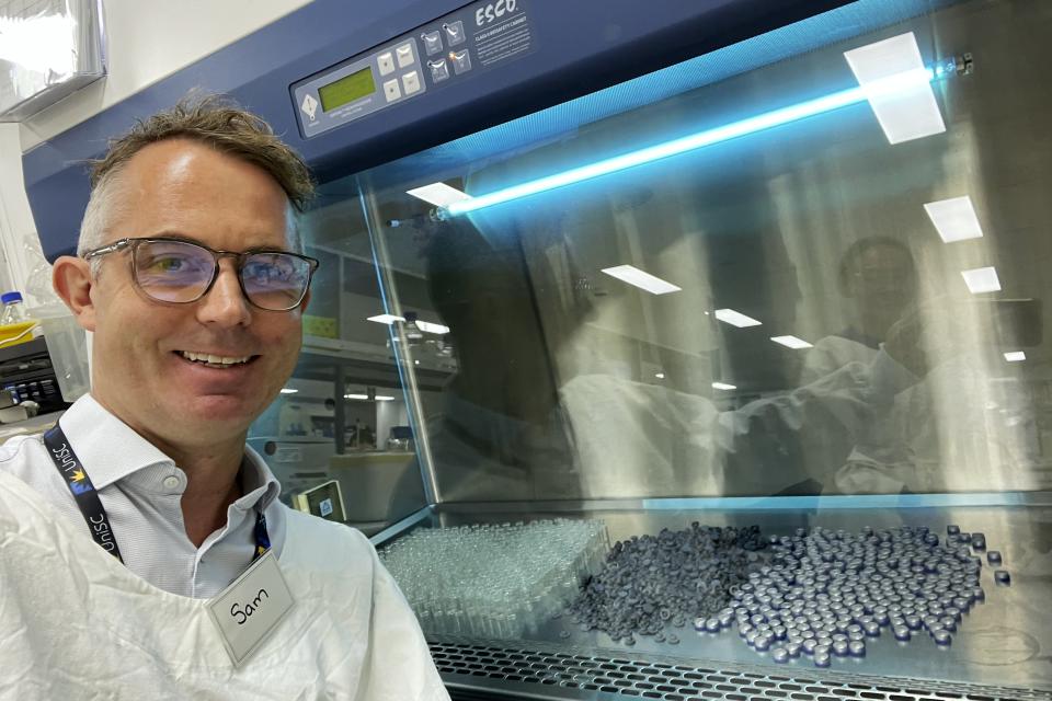 Samuel Phillips poses for a photo in the Laboratory making UniSC Koala Chlamydia vaccine doses for wildlife vaccine trials at the University of the Sunshine Coast in Sippy Downs, Queensland, Australia, on Nov. 15, 2022. Australian scientists have begun vaccinating wild koalas against chlamydia in an ambitious field trial. "It's killing koalas because they become so sick they can't climb trees to get food, or escape predators, and females can become infertile," said Phillips, who helped to develop the vaccine. (Ton Stewart/Samuel Phillips via AP)