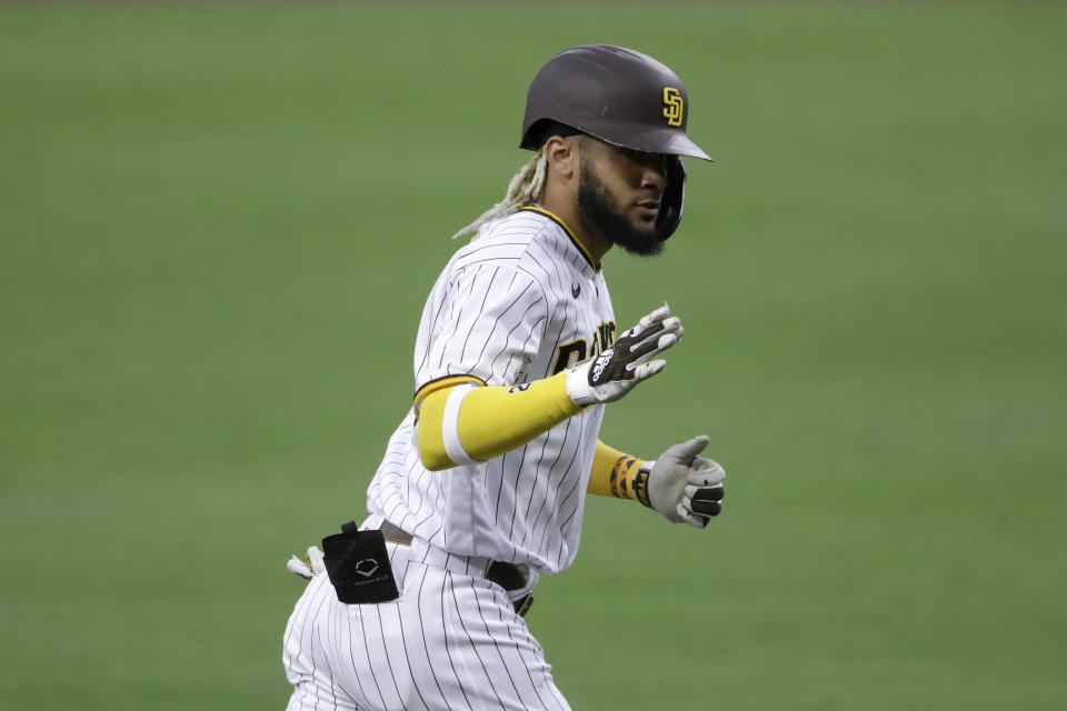 San Diego Padres' Fernando Tatis Jr. reacts after hitting a home run during the fifth inning of a baseball game against the Los Angeles Dodgers, Monday, Aug. 3, 2020, in San Diego. (AP Photo/Gregory Bull)