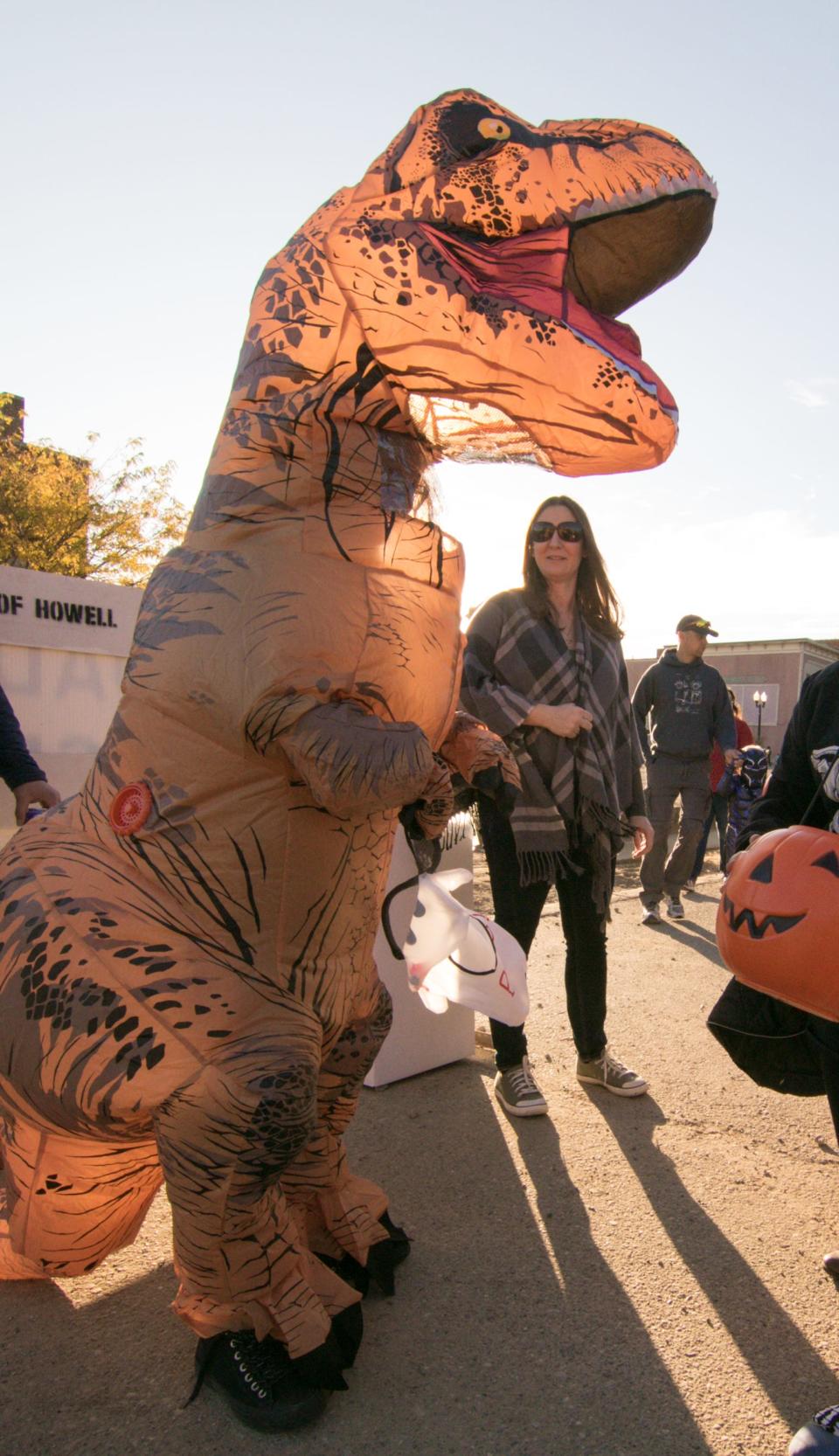 10-year-old Lillian Watkins gets plenty of attention in her dinosaur costume at the Legend of Sleepy Howell on Saturday, Oct. 19, 2019.