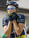 FILE PHOTO: Vacansoleil's team rider Borut Bozic of Slovenia celebrates winning the fifth stage of the Tour de Suisse cycling race in Tobel-Taegerschen June 15, 2011. REUTERS/Denis Balibouse