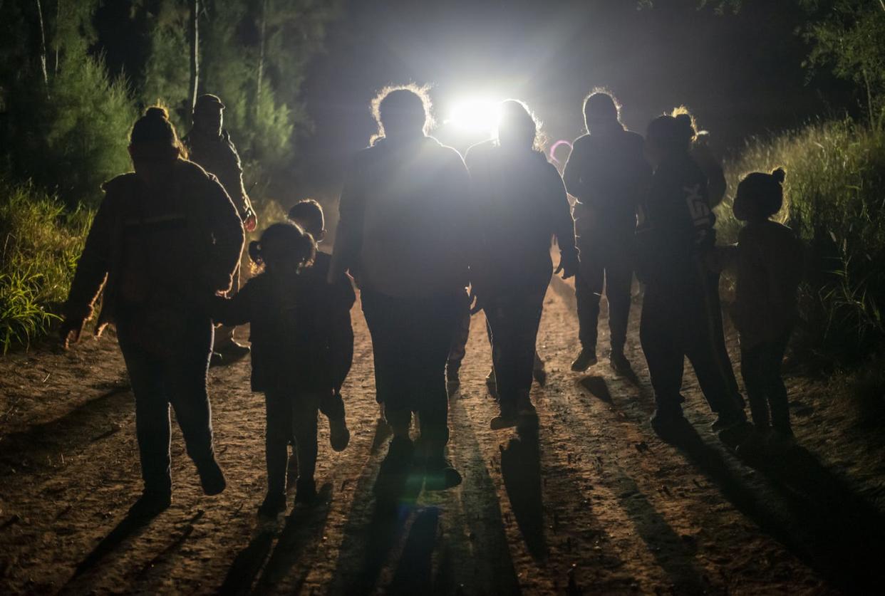 <span class="caption">If a proposed law passes, this group of immigrants apprehended at the U.S. border near Mission, Texas, would be called 'noncitizens,' not 'aliens.'</span> <span class="attribution"><a class="link " href="https://www.gettyimages.com/detail/news-photo/group-of-undocumented-immigrants-walk-toward-a-customs-and-news-photo/1231297089?adppopup=true" rel="nofollow noopener" target="_blank" data-ylk="slk:Sergio Flores for The Washington Post via Getty Images;elm:context_link;itc:0;sec:content-canvas">Sergio Flores for The Washington Post via Getty Images</a></span>