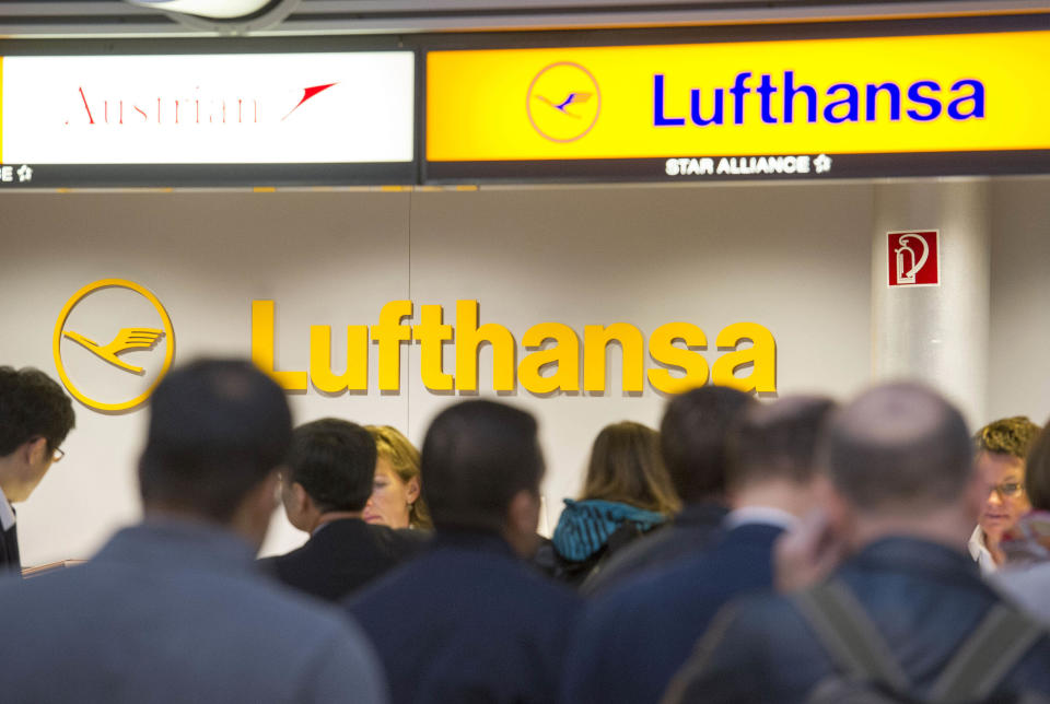 Passengers wait in front of a Lufthansa counter in Hamburg, northern Germany, Friday, Sept. 7, 2012. Lufthansa canceled about two-thirds of its flights Friday after flight attendants walked off the job at airports around the country in an escalating battle with Germany's largest airline, but signs emerged that the two sides may be prepared to return to the negotiating table. (AP Photo/dapd, Olaf Malzahn)