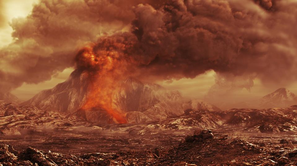 a red rock landscape covered with thick brown smoke from an erupting volcano