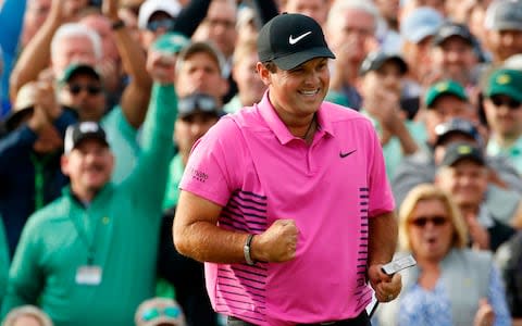 Patrick Reed reacts after winning the Masters - Credit: AP