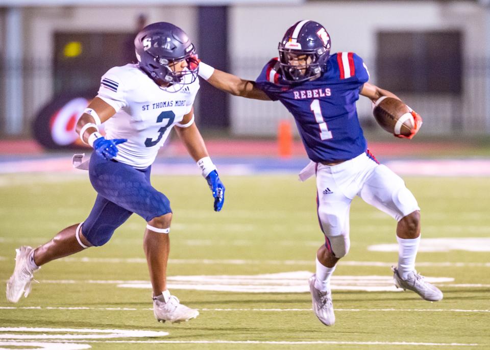 Rebels Kentrell Prejean runs the ball as the Teurlings Rebels take on the STM Cougars. Friday, Oct. 21, 2022.