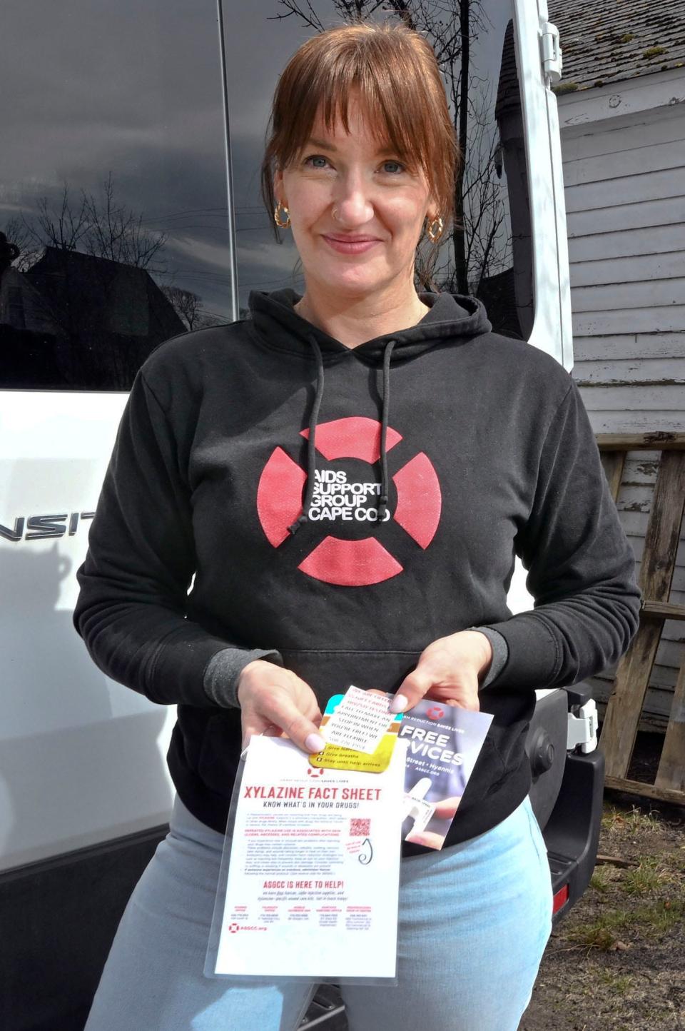 Eliza Morrison, program manager for the AIDS Support Group in Hyannis holds pamphlets about xylazine often passed out to prospective clients.