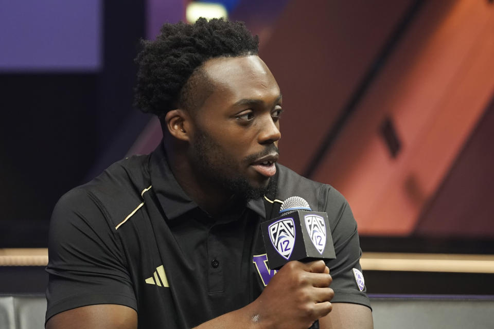 FILE - Washington linebacker Edefuan Ulofoshio speaks at the Pac-12 NCAA college football media day, Friday, July 21, 2023, in Las Vegas. Washington opens their season at home against Boise State on Sept. 2.(AP Photo/Lucas Peltier, File)