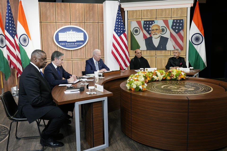 President Joe Biden meets virtually with Indian Prime Minister Narendra Modi in the South Court Auditorium on the White House campus in Washington, Monday, April 11, 2022. Secretary of Defense Lloyd Austin, left, and Secretary of State Antony Blinken, second left, and Indian Minister of Defense Rajnath Singh, second right, Minister of External Affairs Subrahmanyam Jaishankar is right. (AP Photo/Carolyn Kaster)