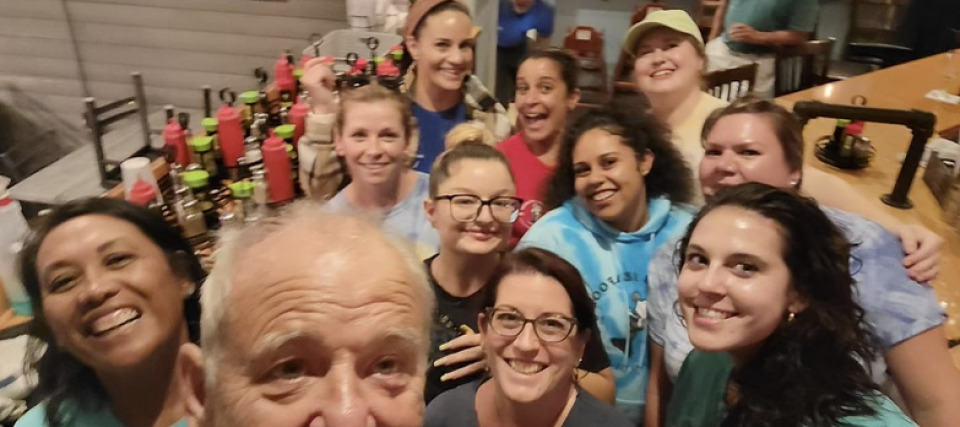 Bill Murray, front, takes a selfie with the staff of Turk's Seafood on Sunday, Aug. 28, while having dinner on the patio.