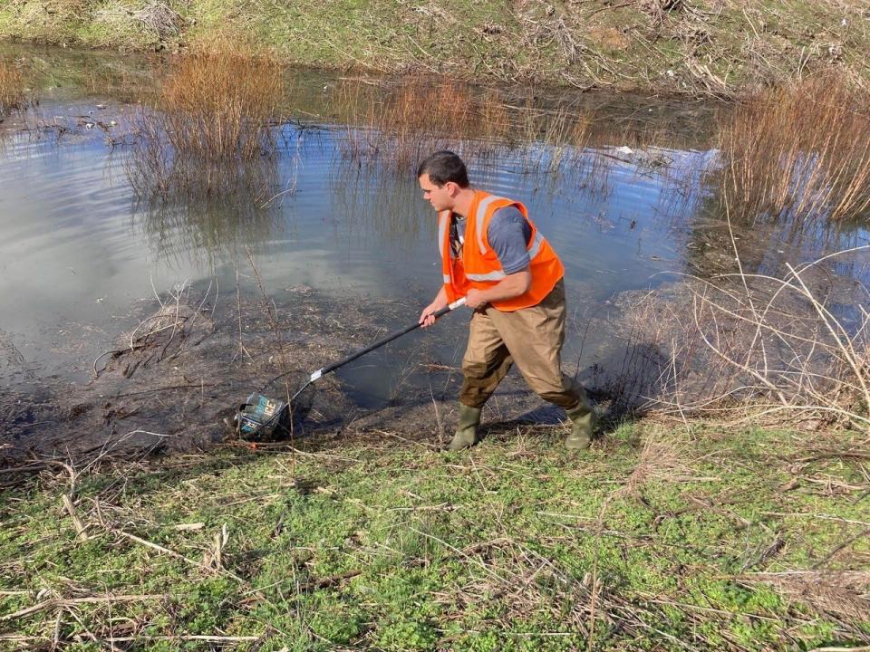 Volunteers remove trash and debris from outdoor spaces during a Keep Knoxville Beautiful event.