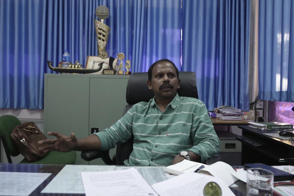 Baburajan P K, chief environmental engineer of the Kerala Pollution Control Board, sits at his office in Eloor, Kerala state, India, Friday, March 3, 2023. "We have not found any alarming rate of metals in the river water. All the levels are within the limits," Baburajan said of the Periyar River. (AP Photo)