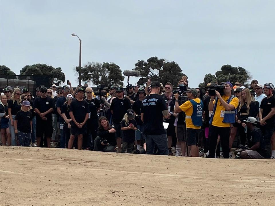 BMX rider Jamie Bestwick addresses a crowd of athletes and family gathered to pay tribute to BMX rider Pat Casey, who died in a dirtbike accident in June, Saturday at the X Games in Ventura, Calif. Many wore t-shirts reading "Pat Casey Forever."