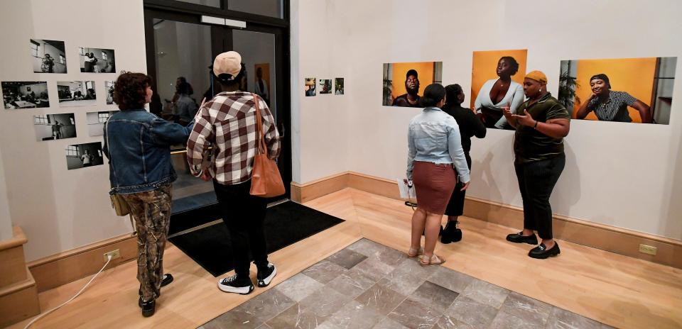 Those attending as the ACLU and TKO launch the Black Trans Futures storytelling project look photographs at the Montgomery Museum of Fine Arts in Montgomery, Ala., on Thursday October 27, 2022. 