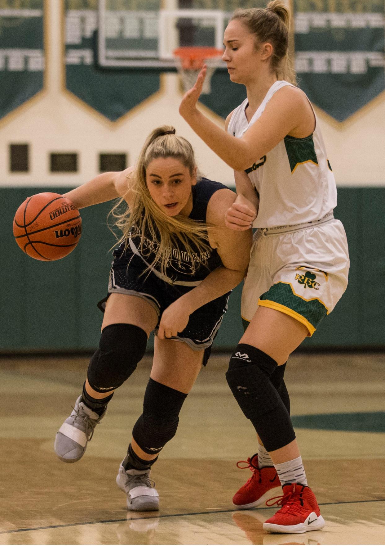 Manasquan's Faith Masonius drives past Red Bank Catholic's Fab Eggenschwiler.  Manasquan vs Red Bank Catholic girls basketball.          Red Bank, NJTuesday, February 5, 2019