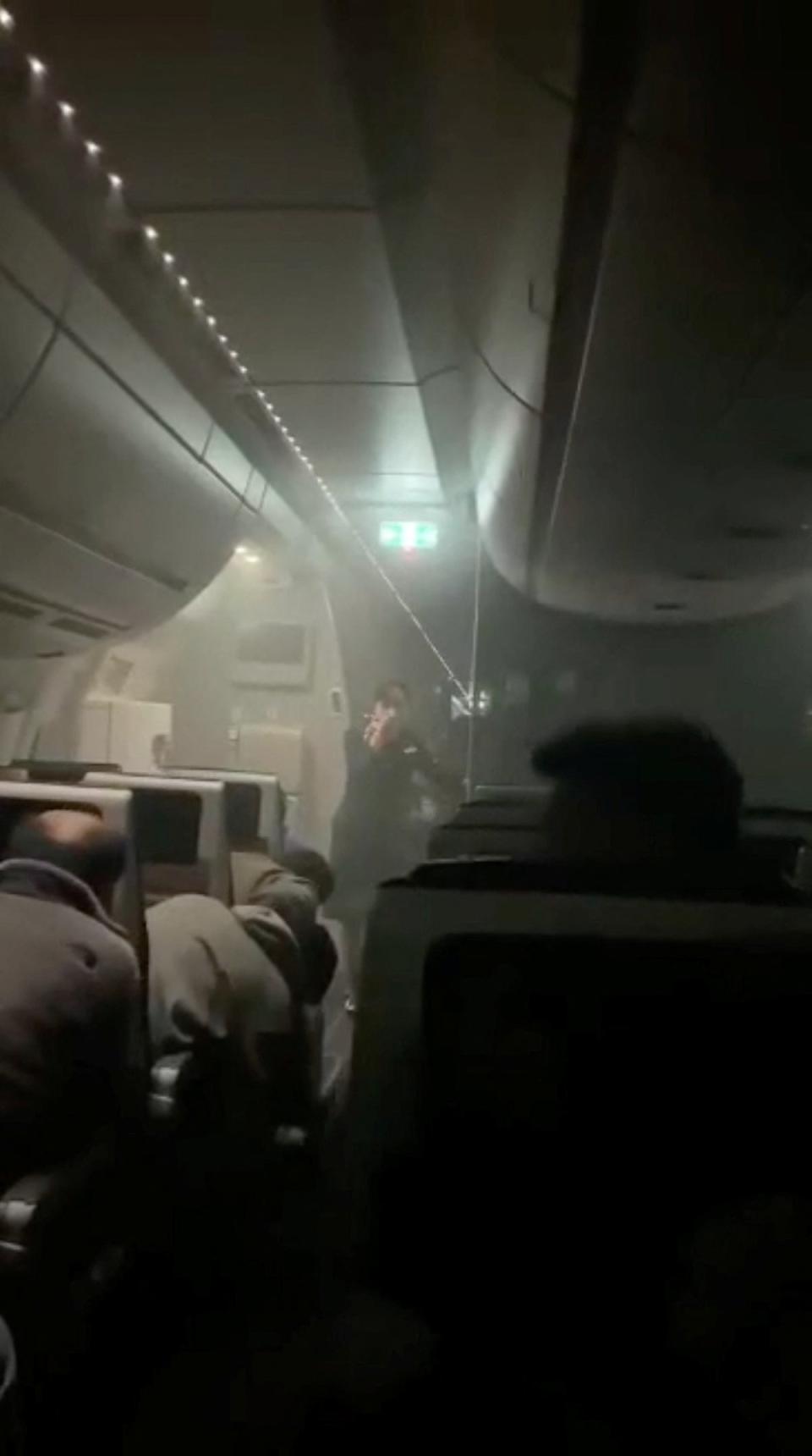 Smoke fills the cabin of the Japan Airlines Airbus-A350 in this screen grab obtained from a social media video (via REUTERS)