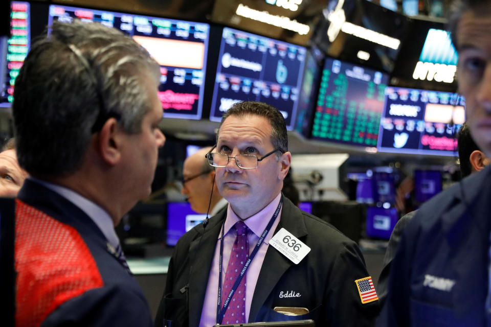 Traders work on the floor at the New York Stock Exchange (NYSE) in New York, U.S., October 22, 2019. REUTERS/Brendan McDermid