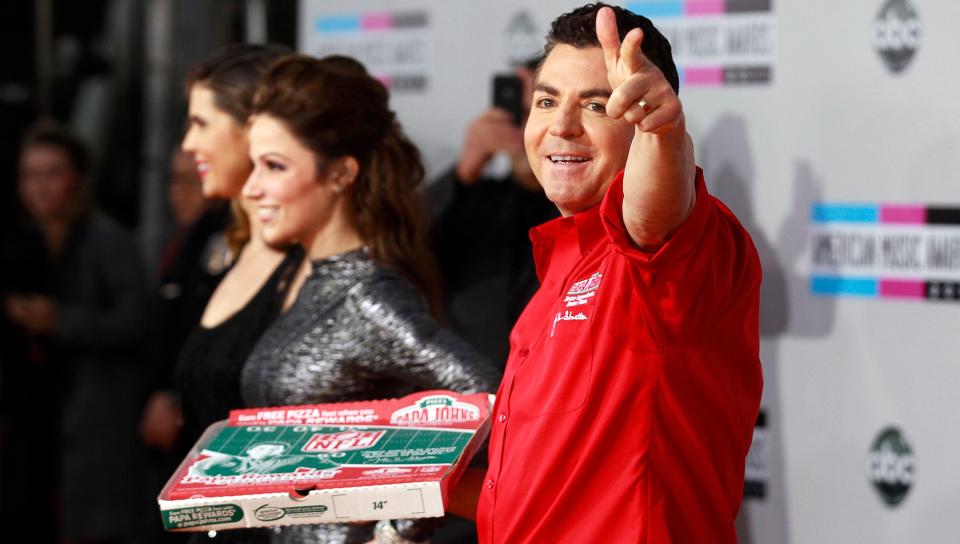 John Schnatter, founder and chief executive of Papa John's Pizza, waves goodbye. (Photo: Danny Moloshok / Reuters)