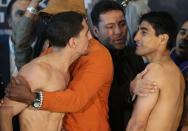 NEW YORK, NY - OCTOBER 19: (L-R) Boxers Danny Garcia and Erik Morales exchange words during their weigh in at the Barclays Center on October 19, 2012 in the Brooklyn Borough of New York City. (Photo by Alex Trautwig/Getty Images)