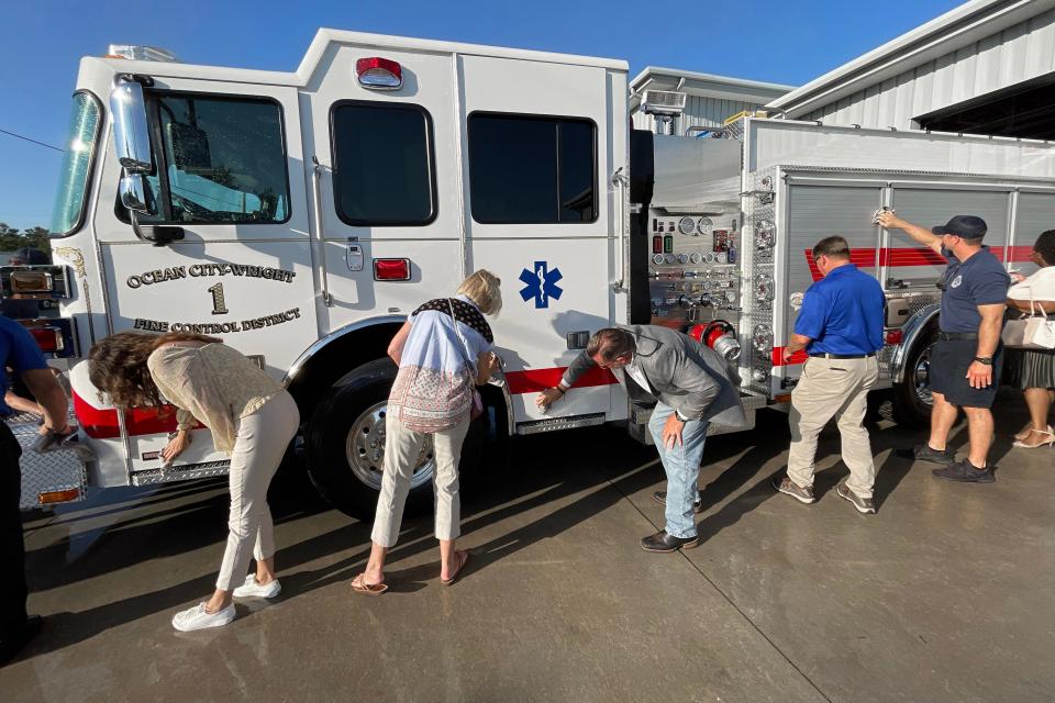 Firefighters, residents and community leaders gathered at the Ocean City-Wright Fire Control District's Racetrack Road station Tuesday evening to welcome new fire engine.