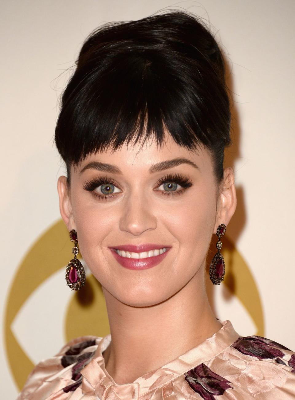 <p>Get that Katy Perry look — perfect for weddings, special occasions, and more — with short, cute bangs and <a href="https://www.goodhousekeeping.com/beauty/hair/advice/g5172/wedding-updos/" rel="nofollow noopener" target="_blank" data-ylk="slk:simple updo;elm:context_link;itc:0;sec:content-canvas" class="link ">simple updo</a>.</p><p><strong>RELATED: </strong><a href="https://www.goodhousekeeping.com/beauty/hair/tips/g1646/wedding-guest-hair-styles/" rel="nofollow noopener" target="_blank" data-ylk="slk:25 Easy Wedding Guest Hairstyles for Every Dress Code;elm:context_link;itc:0;sec:content-canvas" class="link ">25 Easy Wedding Guest Hairstyles for Every Dress Code</a></p>