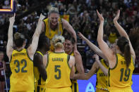 Australia's Lauren Jackson is held aloft by teammates as they celebrate after defeating Canada in their bronze medal game at the women's Basketball World Cup in Sydney, Australia, Saturday, Oct. 1, 2022. (AP Photo/Mark Baker)