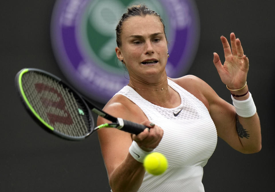 Belarus's Aryna Sabalenka returns the ball to Romania's Monica Niculescu during their first round women's singles match on day one of the Wimbledon Tennis Championships in London, Monday June 28, 2021. (AP Photo/Alastair Grant)