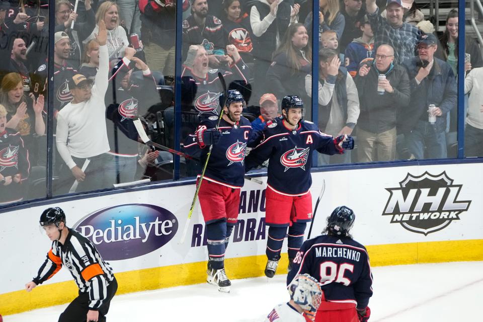 Mar 24, 2023; Columbus, Ohio, USA;  Columbus Blue Jackets center Boone Jenner (38) celebrates scoring the game-winning goal with left wing Johnny Gaudreau (13) during overtime of the NHL hockey game against the New York Islanders at Nationwide Arena. The Blue Jackets won 5-4. Mandatory Credit: Adam Cairns-The Columbus Dispatch