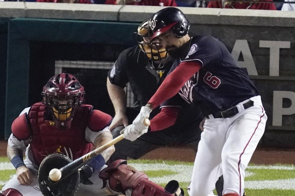 Washington Nationals' Anthony Rendon gets an RBI hit during the third inning of Game 3 of the baseball National League Championship Series against the Washington Nationals Monday, Oct. 14, 2019, in Washington. (AP Photo/Alex Brandon)