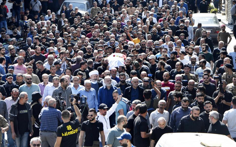 People attend the funeral ceremony of Reuters journalist Issam Abdallah, who was killed by Israeli forces while working in southern Lebanon in Khiam town of Nabatieh Governorate, Lebanon on October 14, 2023.