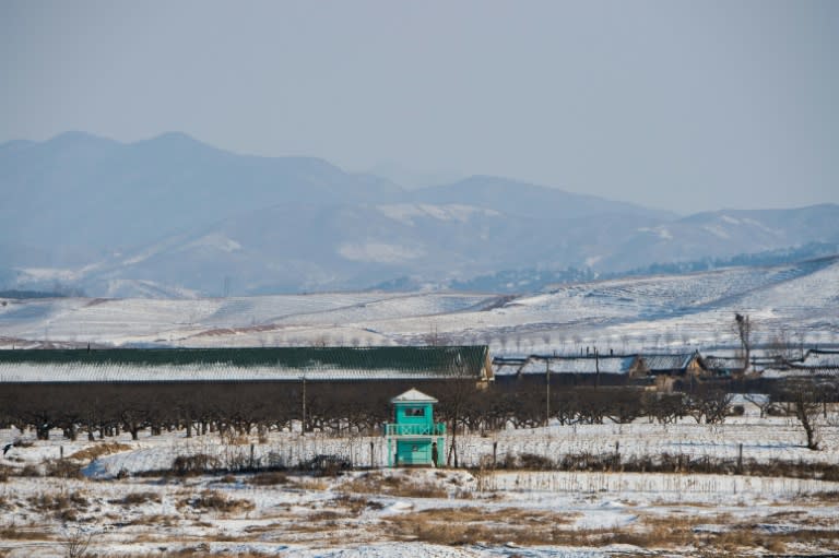 North Korean soldiers are seen at a guard post on the bank of the Yalu river