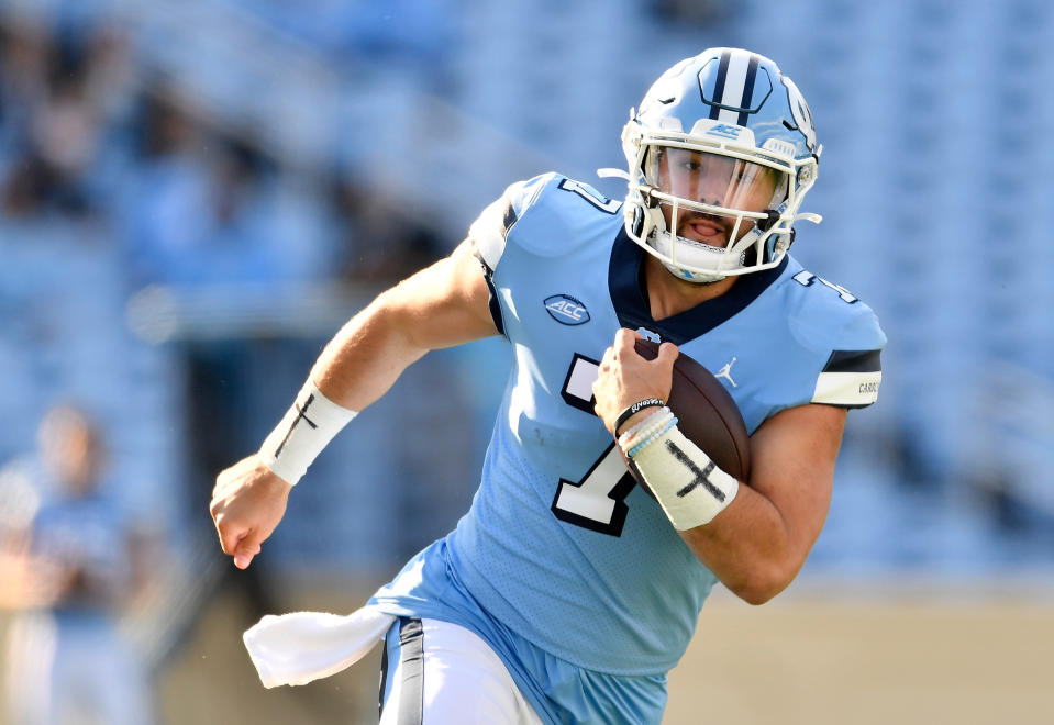 CHAPEL HILL, NORTH CAROLINA - NOVEMBER 14: Sam Howell #7 of the North Carolina Tar Heels scrambles against the Wake Forest Demon Deacons during their game at Kenan Stadium on November 14, 2020 in Chapel Hill, North Carolina. The Tar Heels won 59-53. (Photo by Grant Halverson/Getty Images)