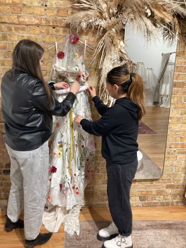 Migonette Bridal staffers preparing a gown for travel.<p>Photo: Courtesy of Mignonette Bridal</p>