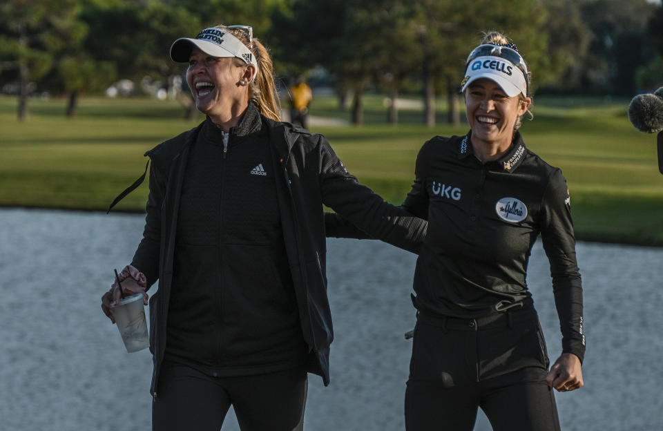 Nelly Korda, right, celebrates with her sister Jessica Korda after she won LPGA Pelican Women's Championship golf tournament at Pelican Golf Club, Sunday, Nov. 14, 2021, in Belleair, Fla. (AP Photo/Steve Nesius)